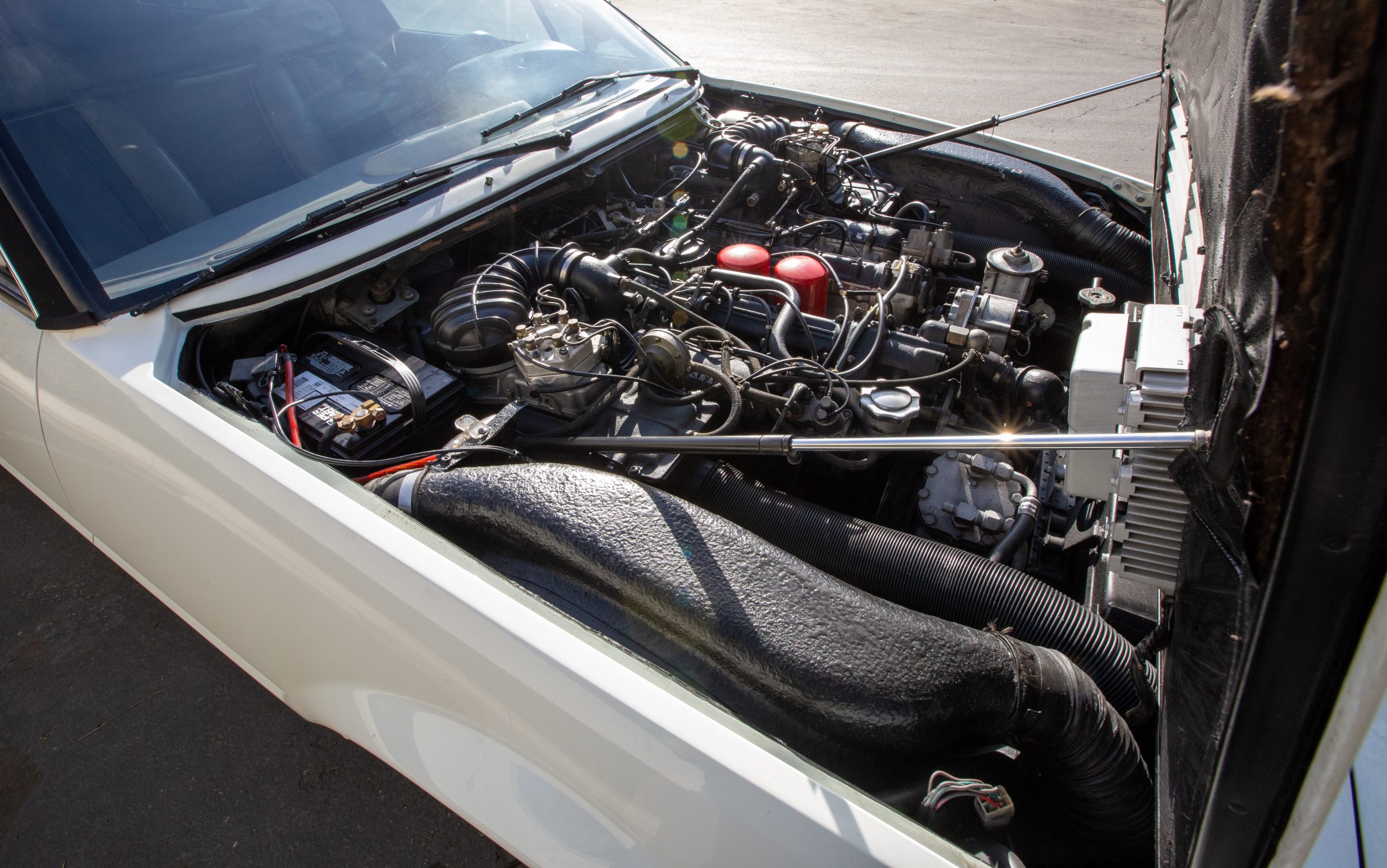 Will Barrett-Jackson Manage To Sell This Bizarre Ferrari 400i Limousine?