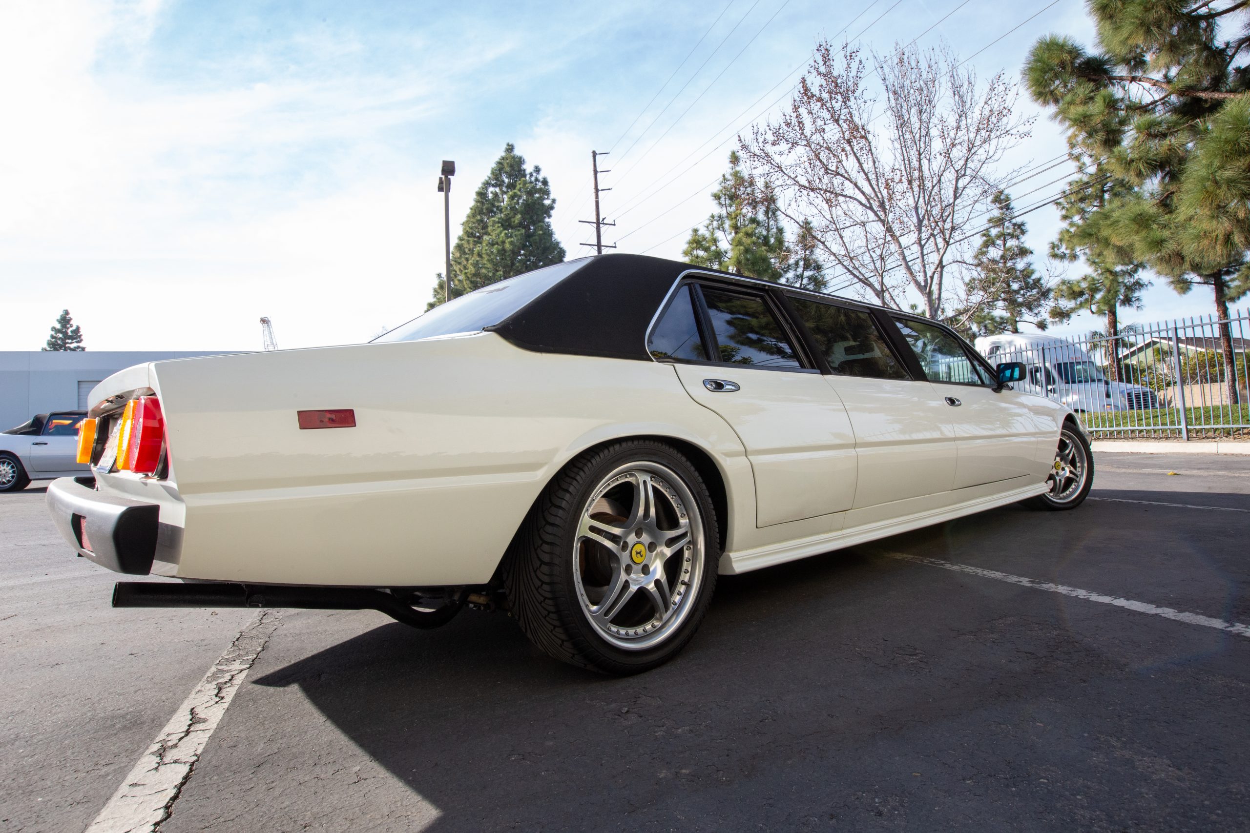 Will Barrett-Jackson Manage To Sell This Bizarre Ferrari 400i Limousine?
