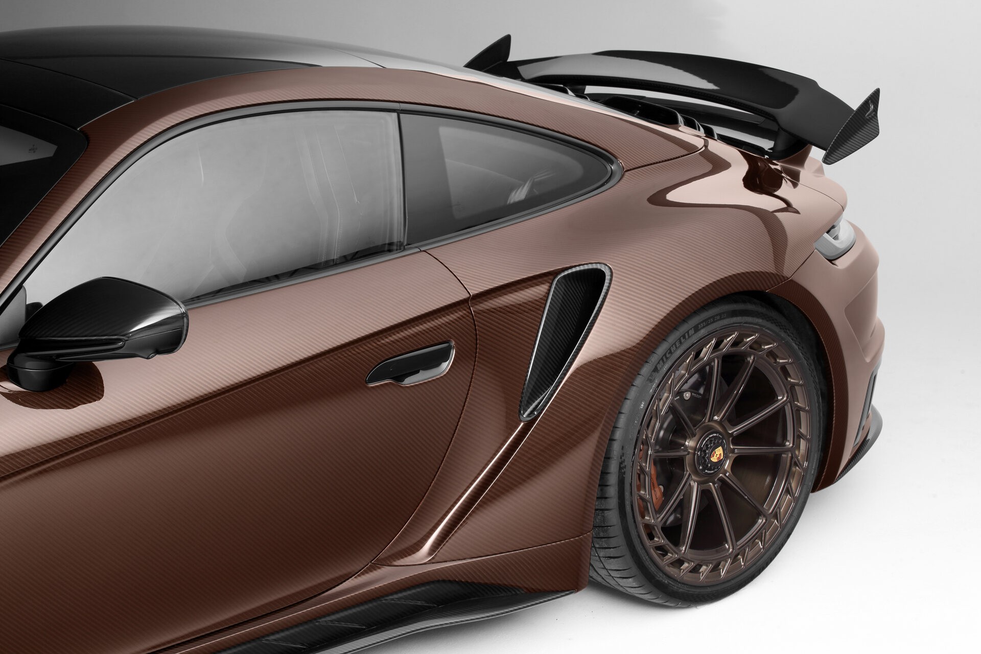 TopCar Dresses Their Tuned Porsche 911 Turbo S In Brown Carbon Fiber