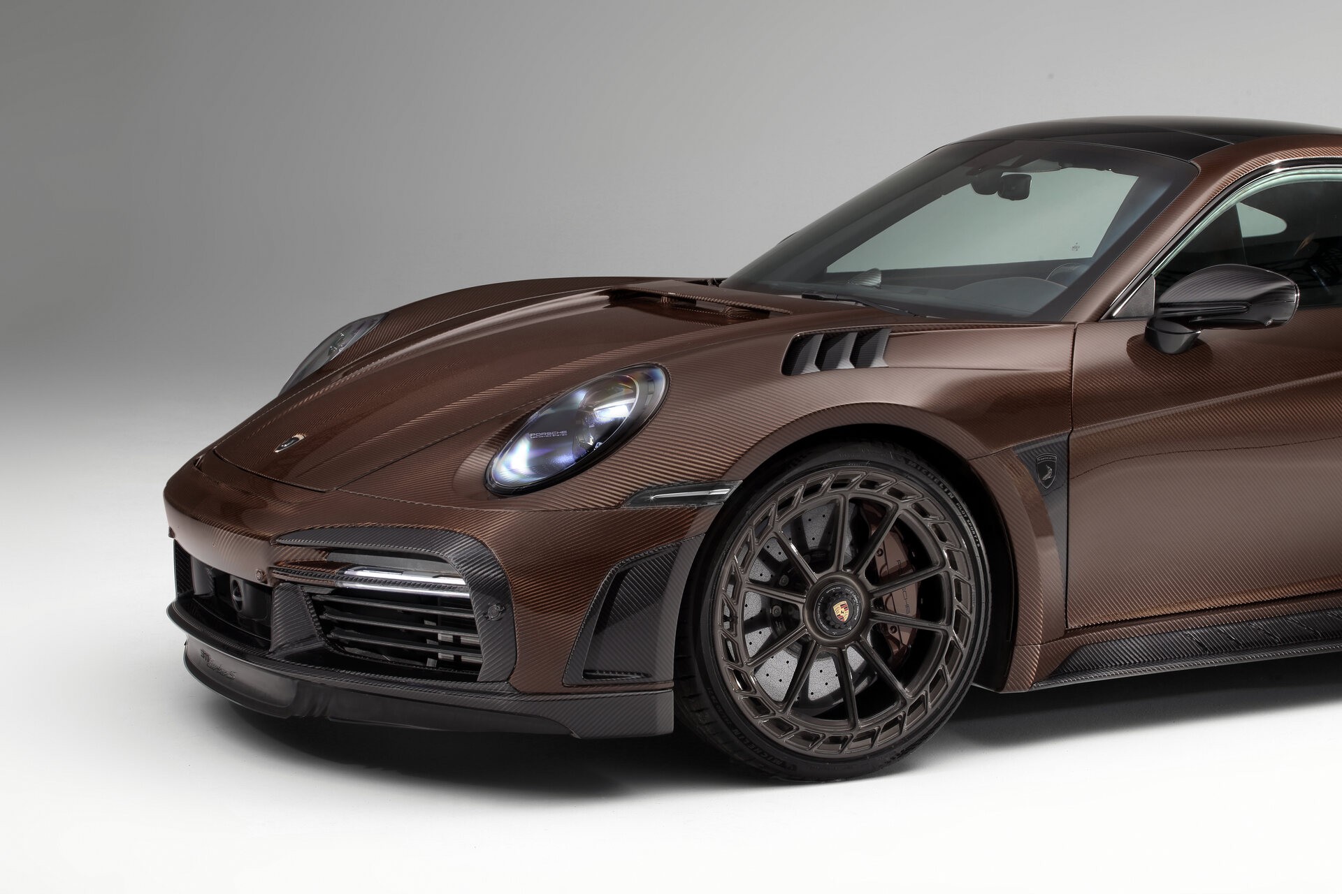 TopCar Dresses Their Tuned Porsche 911 Turbo S In Brown Carbon Fiber