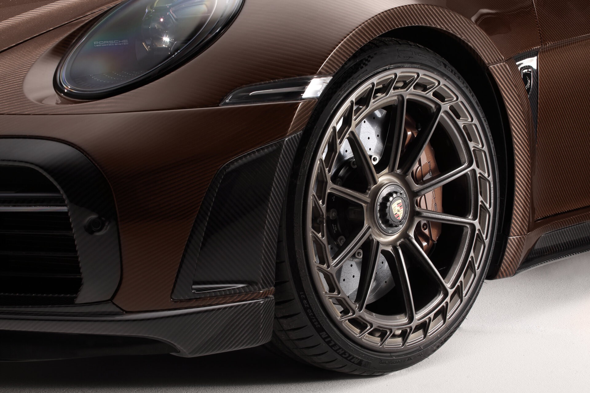 TopCar Dresses Their Tuned Porsche 911 Turbo S In Brown Carbon Fiber