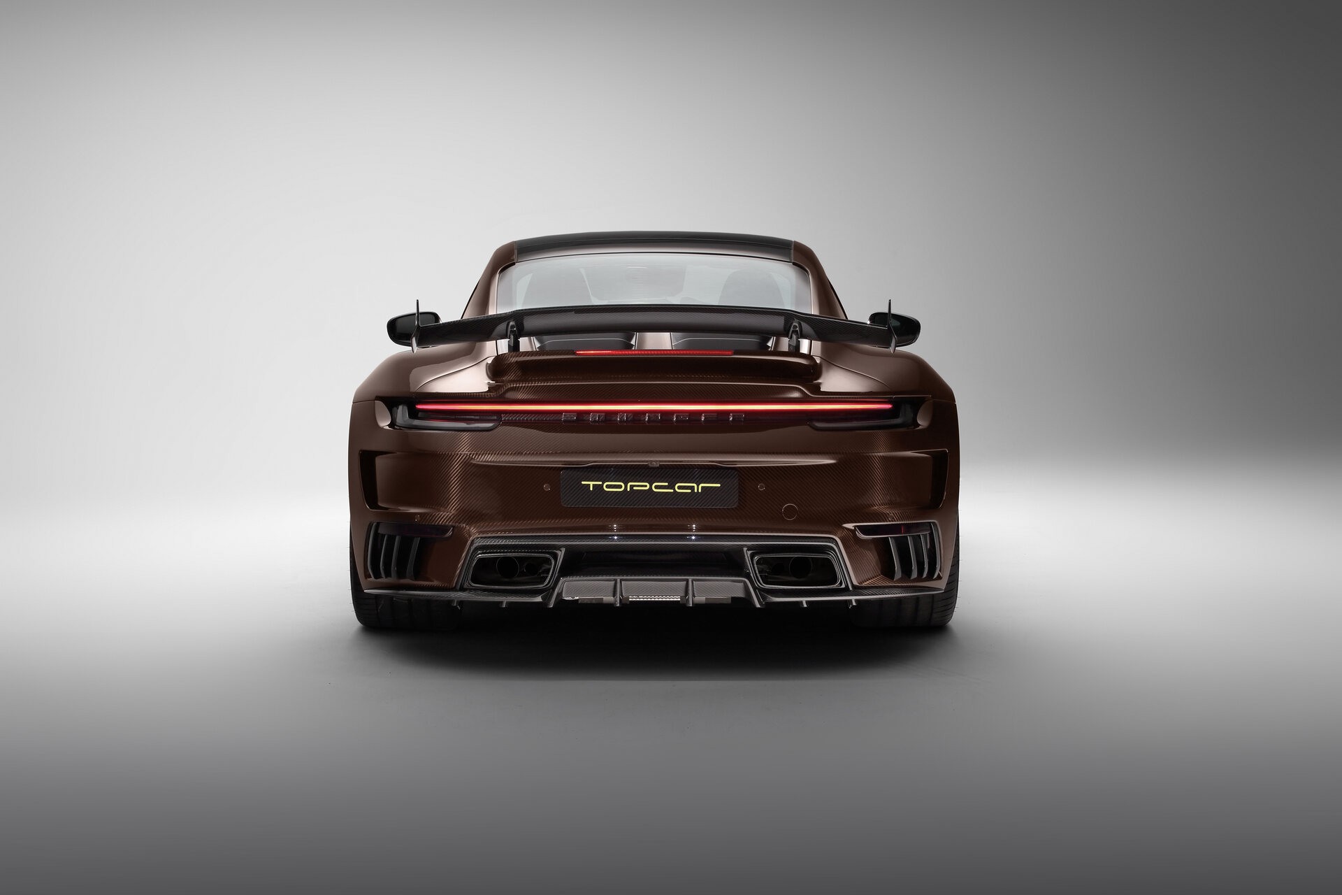 TopCar Dresses Their Tuned Porsche 911 Turbo S In Brown Carbon Fiber