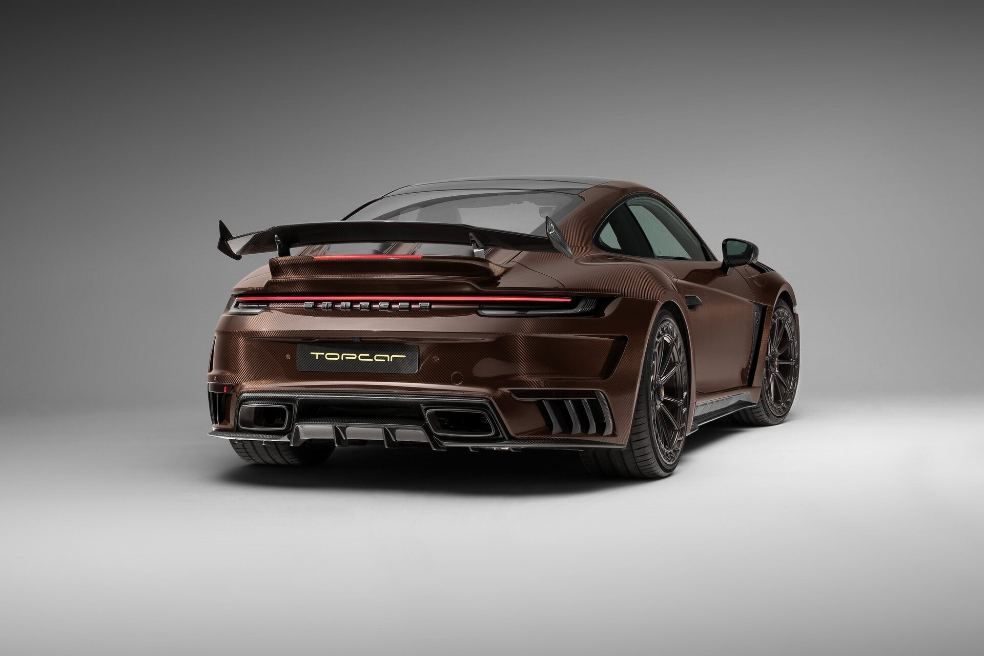 TopCar Dresses Their Tuned Porsche 911 Turbo S In Brown Carbon Fiber