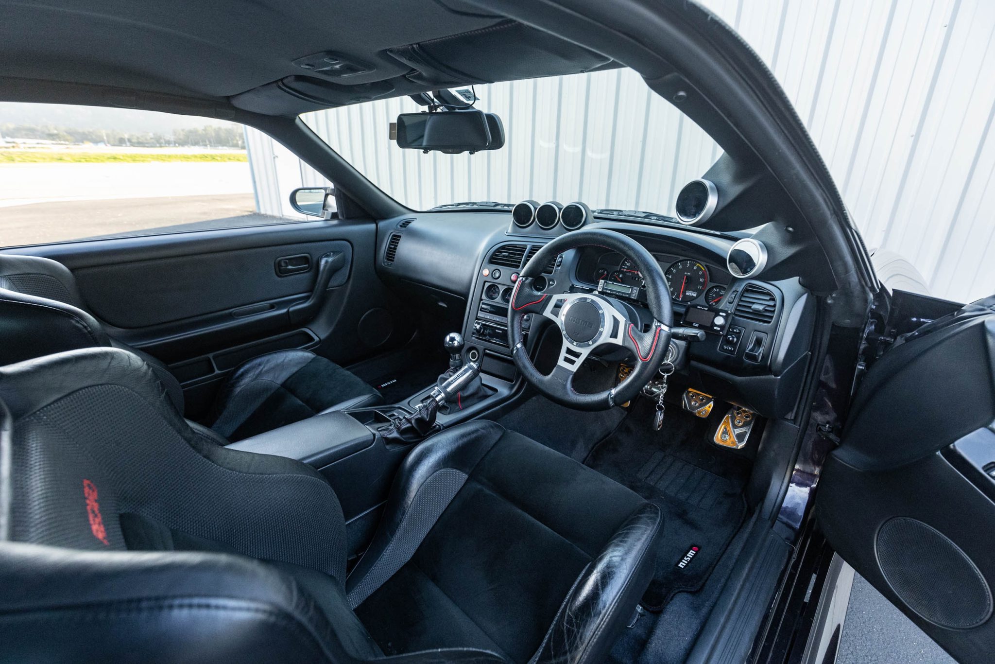 Time To Find Out How Much This Midnight Purple Nissan R33 Skyline GT-R V-Spec Is Worth