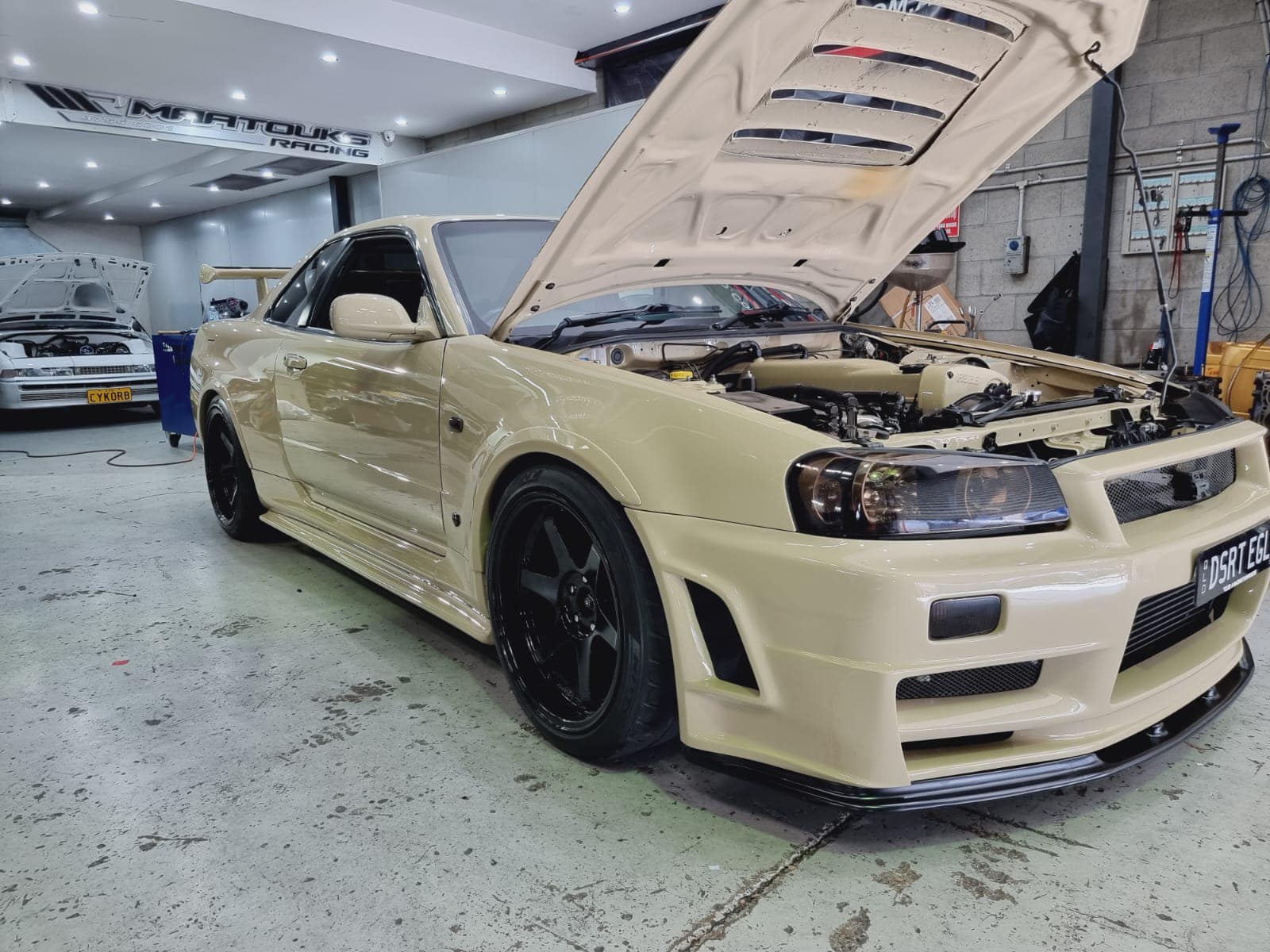 Tan Colored Nissan Skyline R34 Gt R With 1 150 Hp Would Look Right At Home In A Desert Carscoops