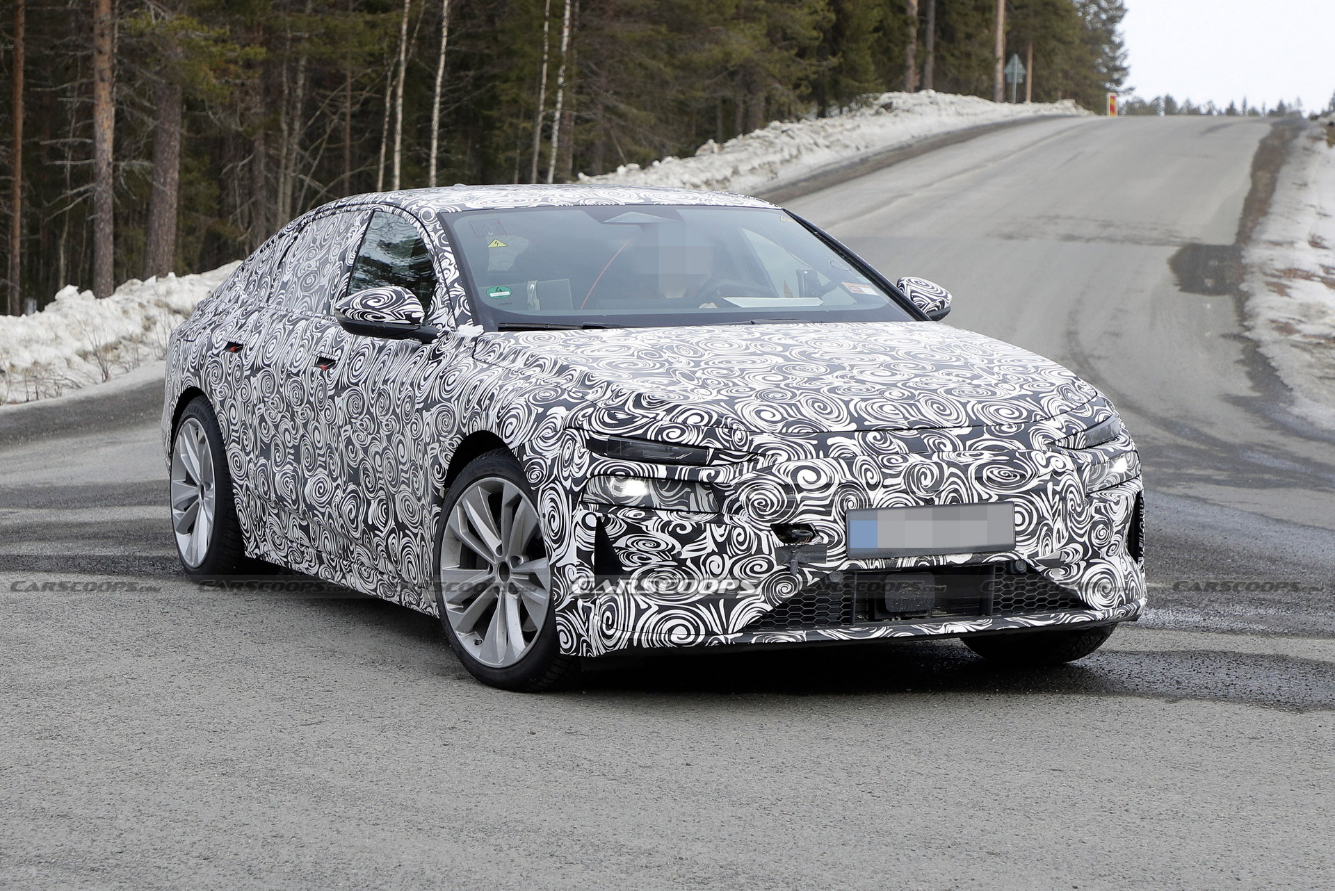 2024 Audi A6 E-Tron Spied Again Showing Split Headlights And Toned-Down Styling