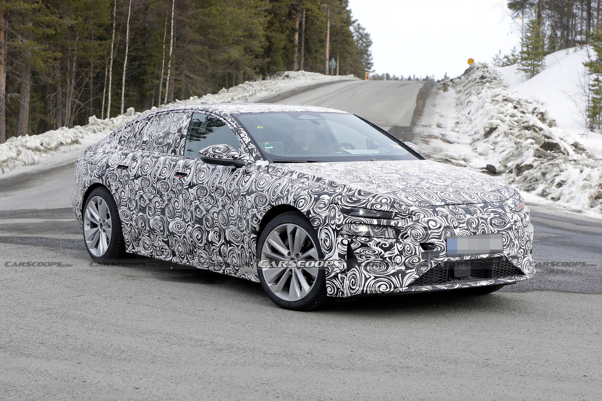 2024 Audi A6 E-Tron Spied Again Showing Split Headlights And Toned-Down Styling