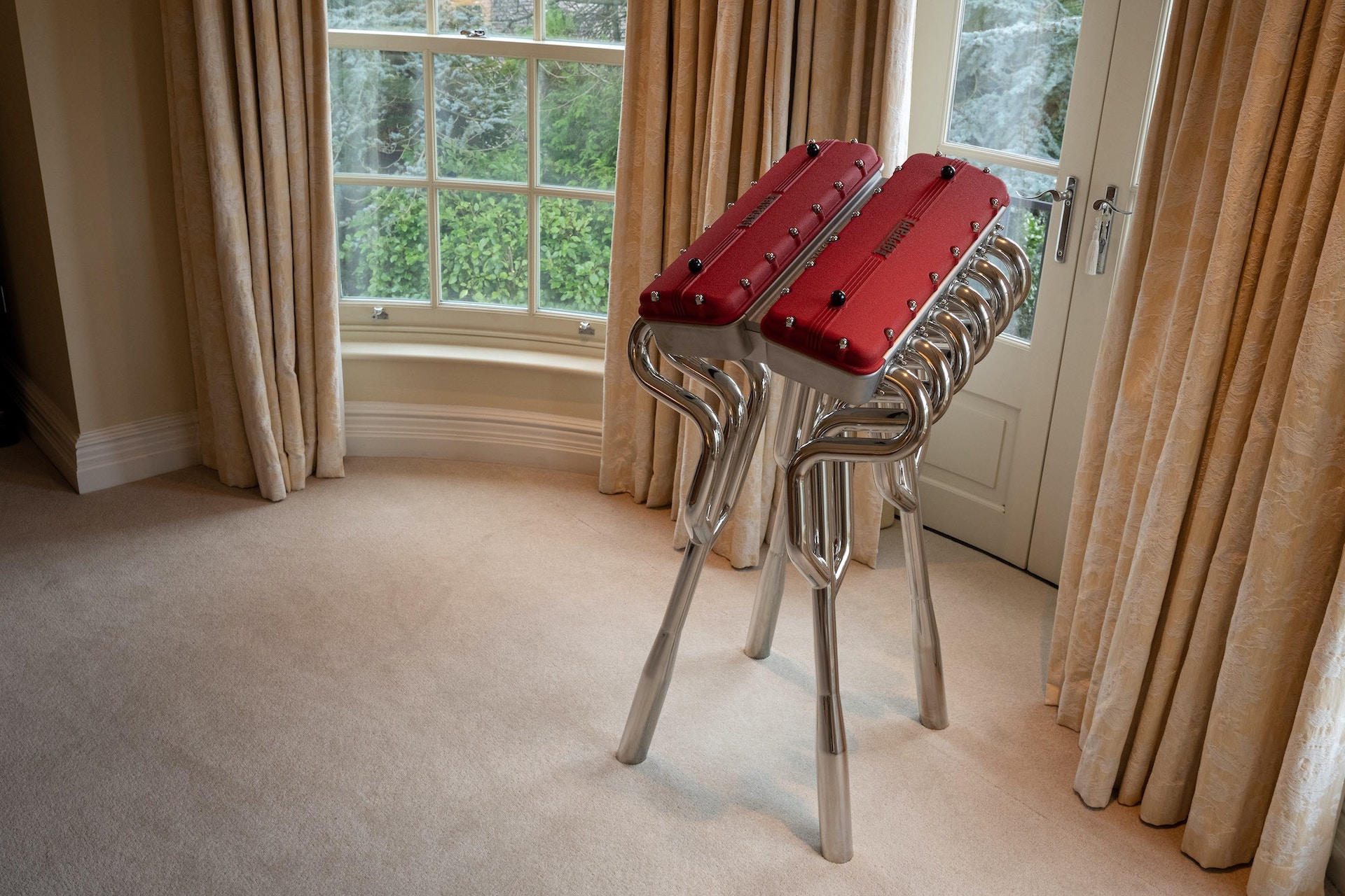 This $30,000 Ferrari Book Comes With A Stand Made From Fake Rocker Covers And Exhaust Headers