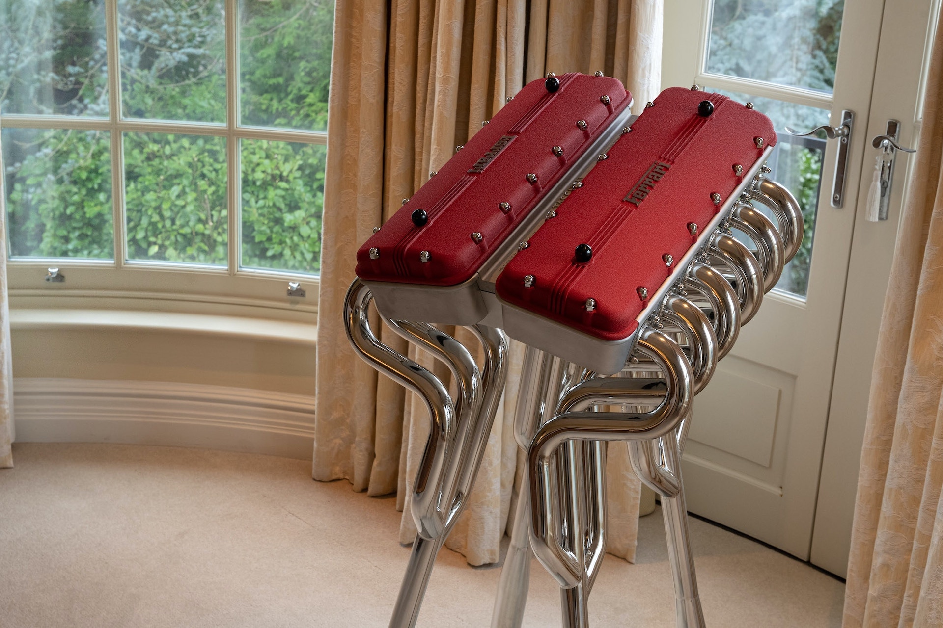 This $30,000 Ferrari Book Comes With A Stand Made From Fake Rocker Covers And Exhaust Headers