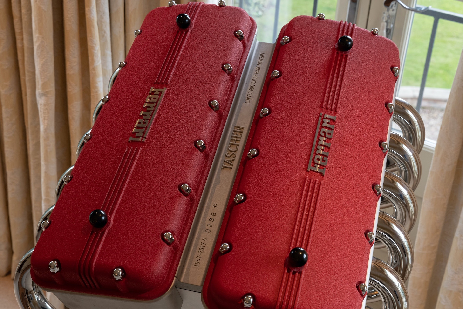 This $30,000 Ferrari Book Comes With A Stand Made From Fake Rocker Covers And Exhaust Headers