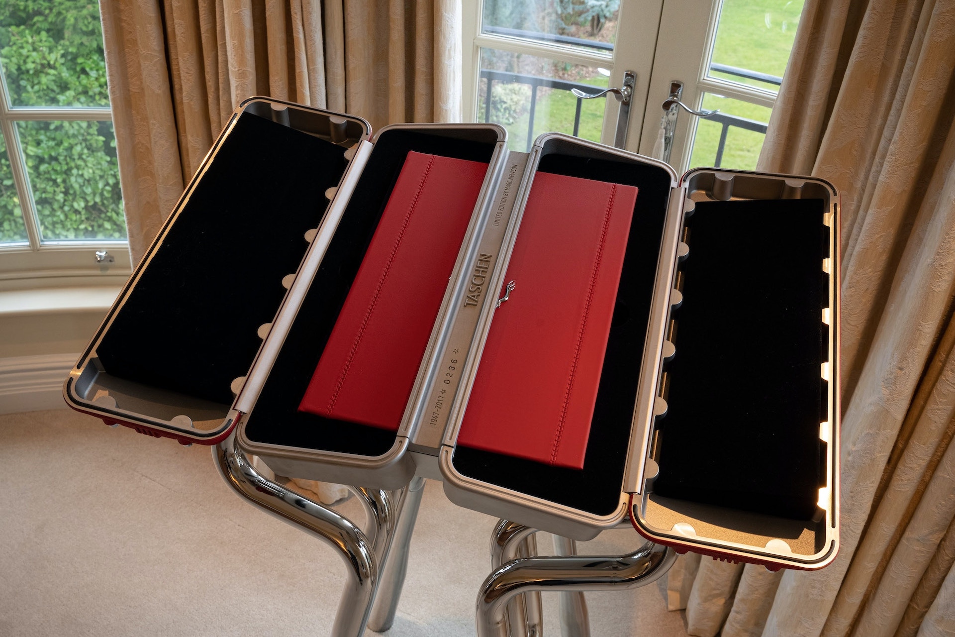 This $30,000 Ferrari Book Comes With A Stand Made From Fake Rocker Covers And Exhaust Headers