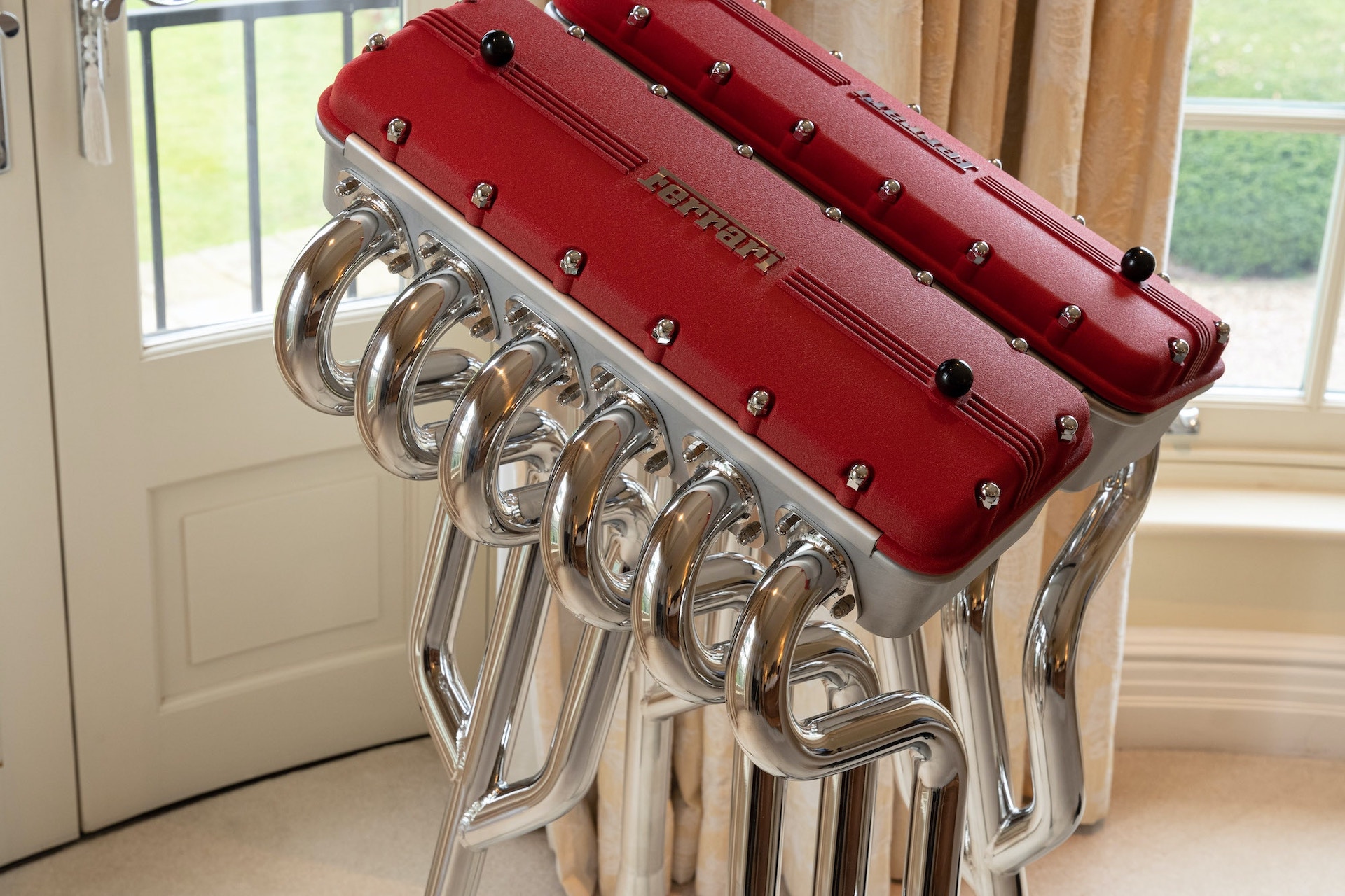 This $30,000 Ferrari Book Comes With A Stand Made From Fake Rocker Covers And Exhaust Headers
