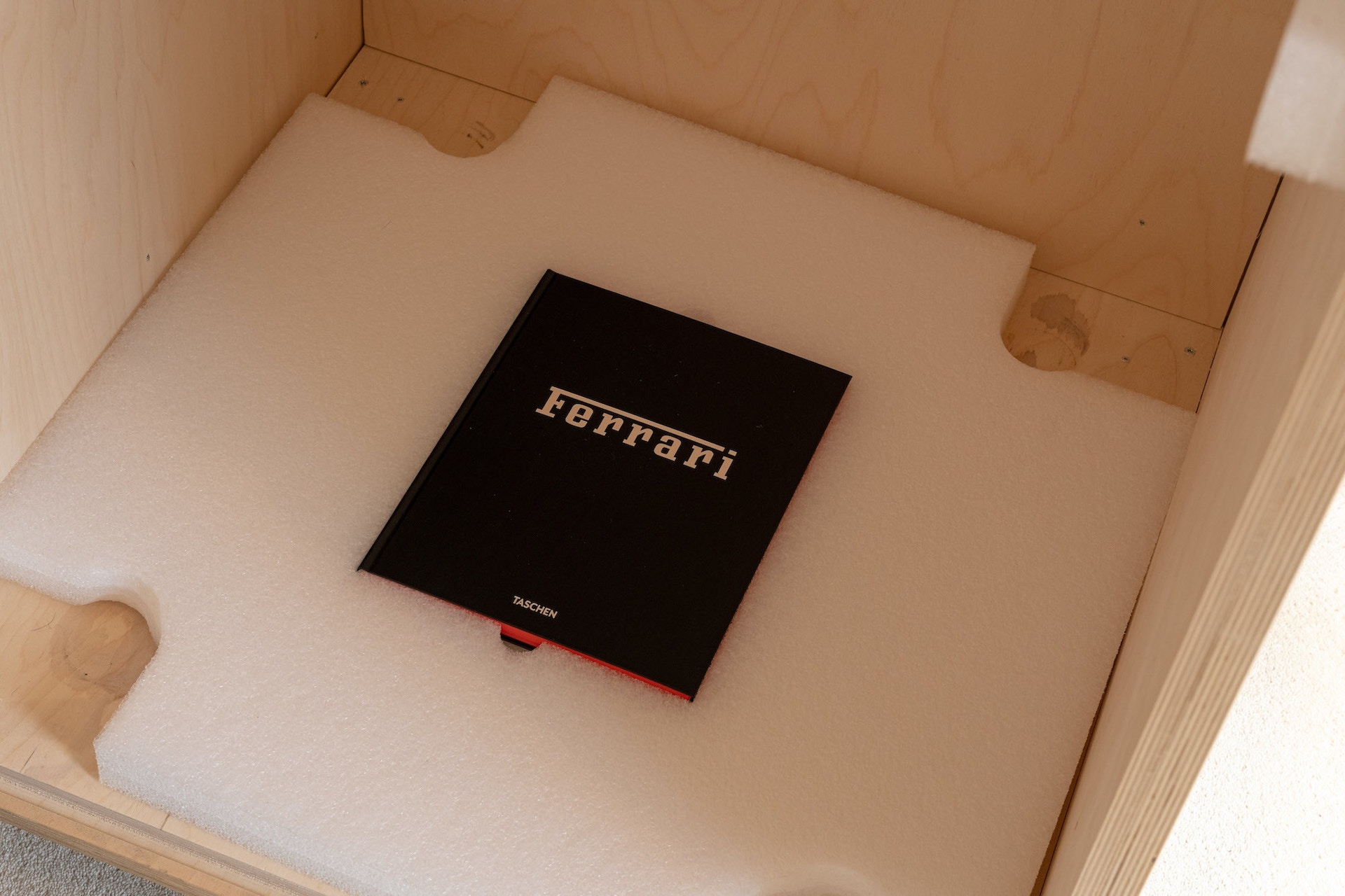 This $30,000 Ferrari Book Comes With A Stand Made From Fake Rocker Covers And Exhaust Headers