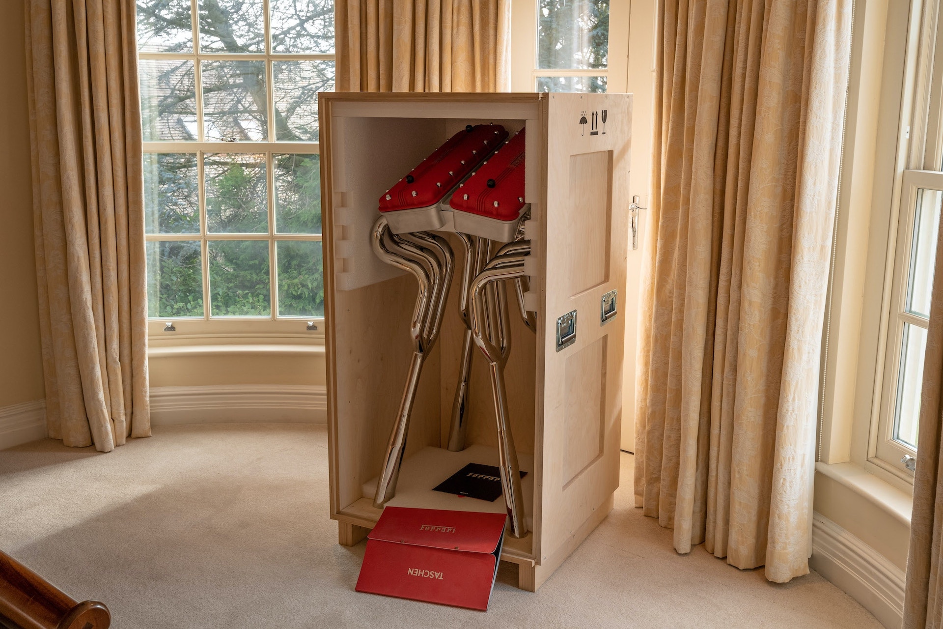 This $30,000 Ferrari Book Comes With A Stand Made From Fake Rocker Covers And Exhaust Headers