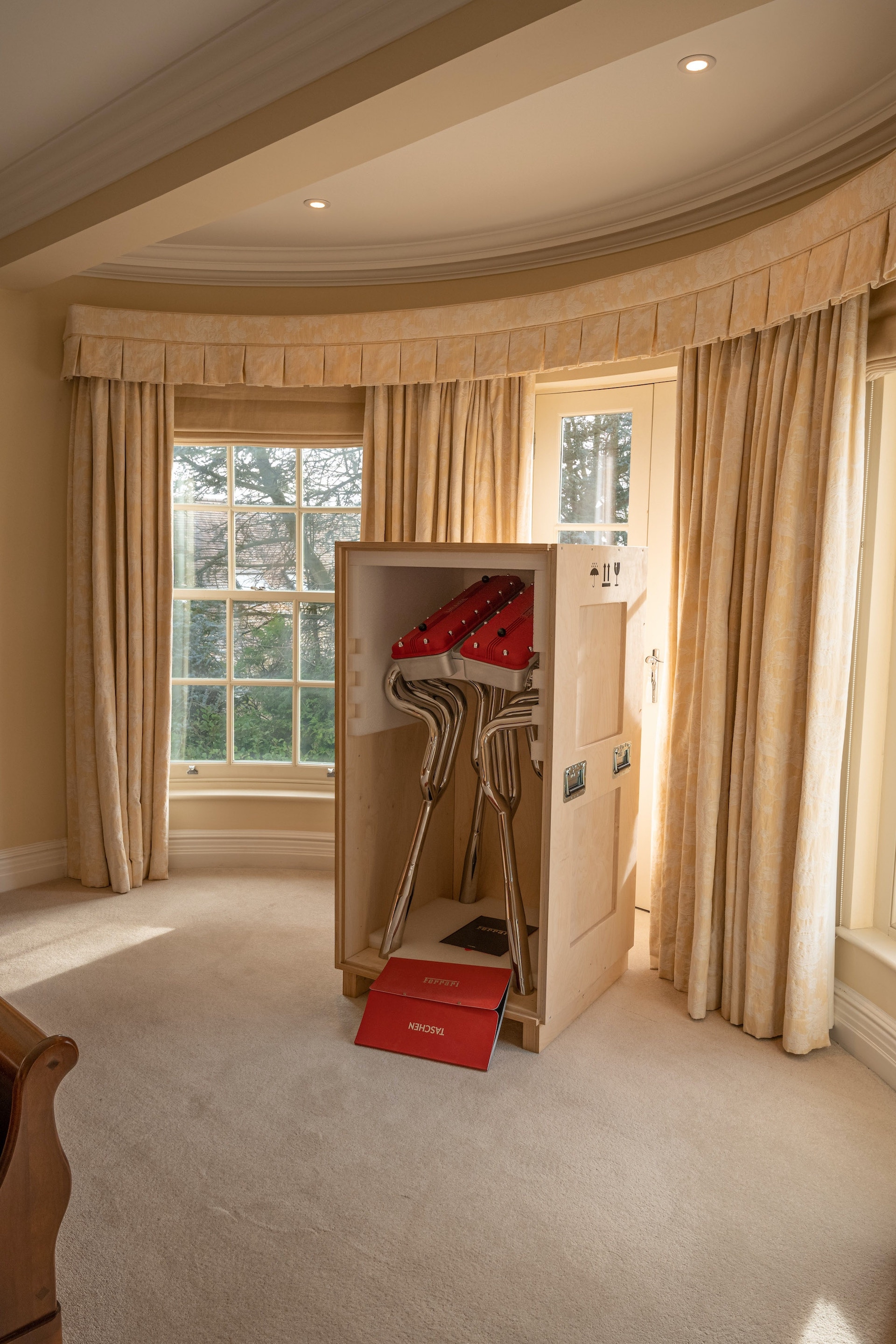 This $30,000 Ferrari Book Comes With A Stand Made From Fake Rocker Covers And Exhaust Headers