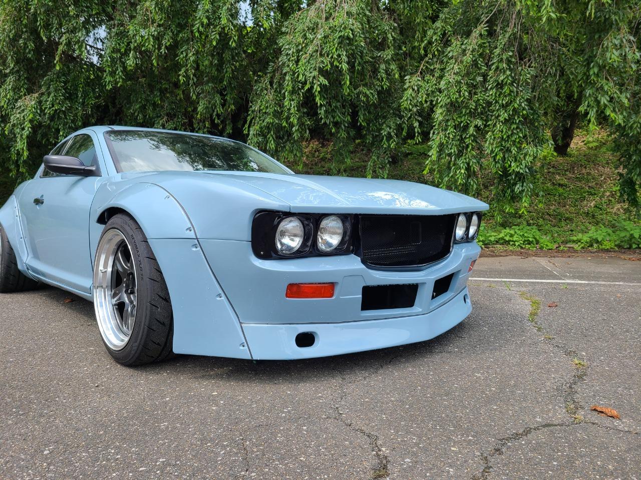 Mazda RX-8 Gets A Reverse Restomod With A ’70s Savannah RX-3 Facelift