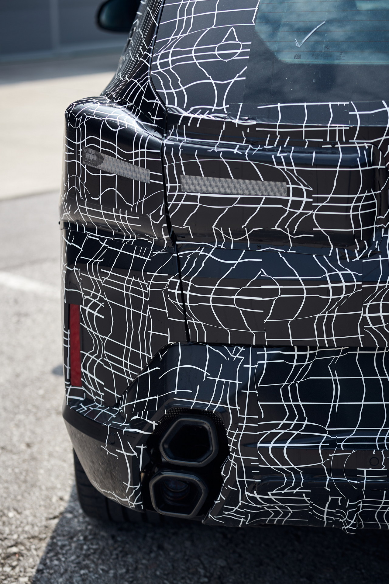 BMW XM Spotted At An Airport With Less Camo, Lots Of Grille