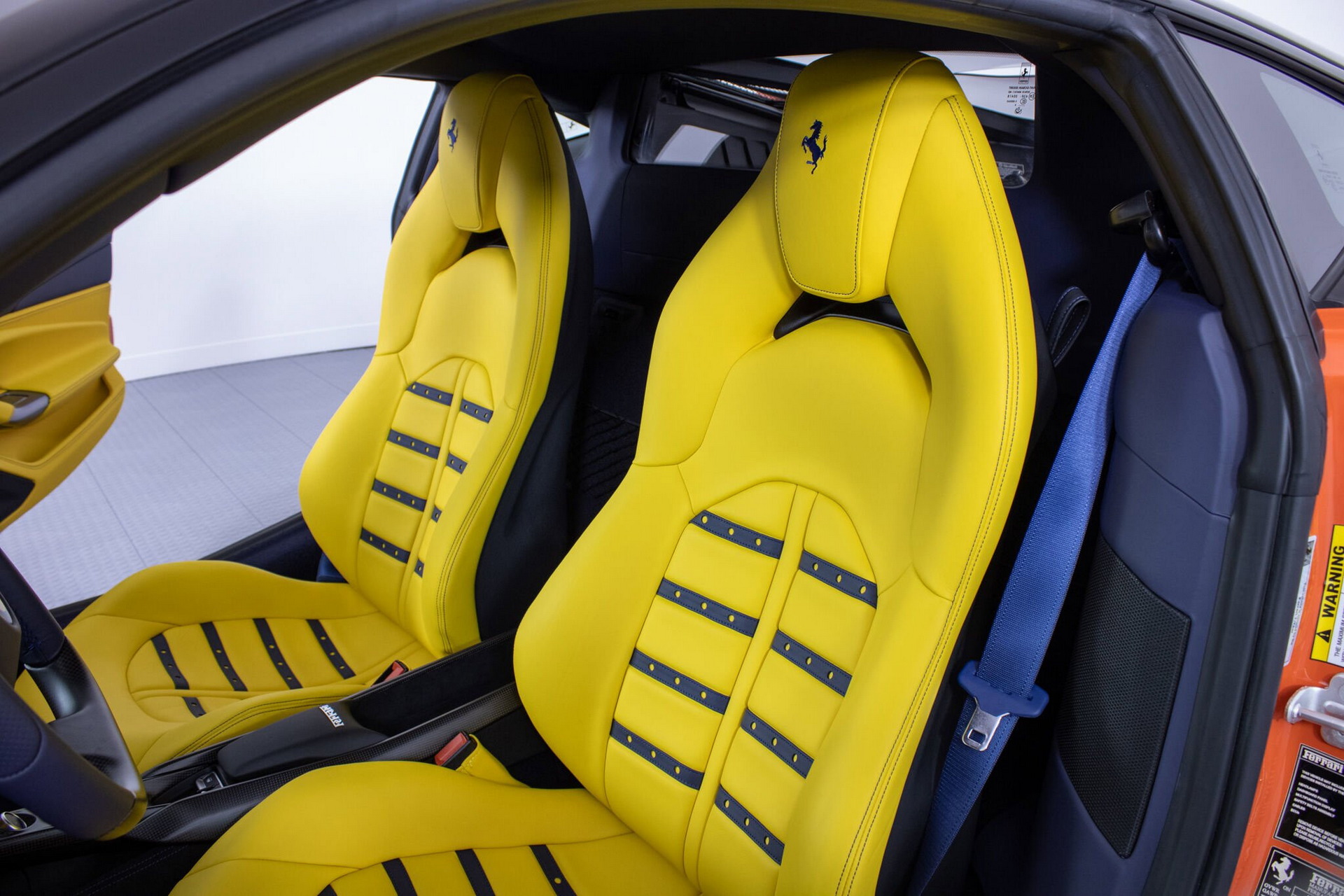 Orange Ferrari F8 Tributo With Blue And Yellow Interior Proves Money Doesn’t Always Buy Taste