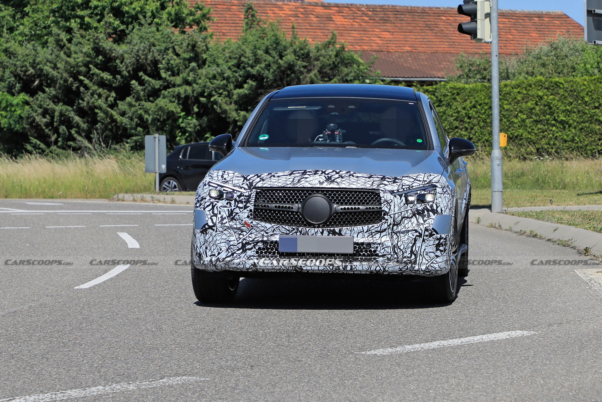 Style-Driven 2024 Mercedes-Benz GLC Coupe Spied Flaunting Its Sloping Roofline