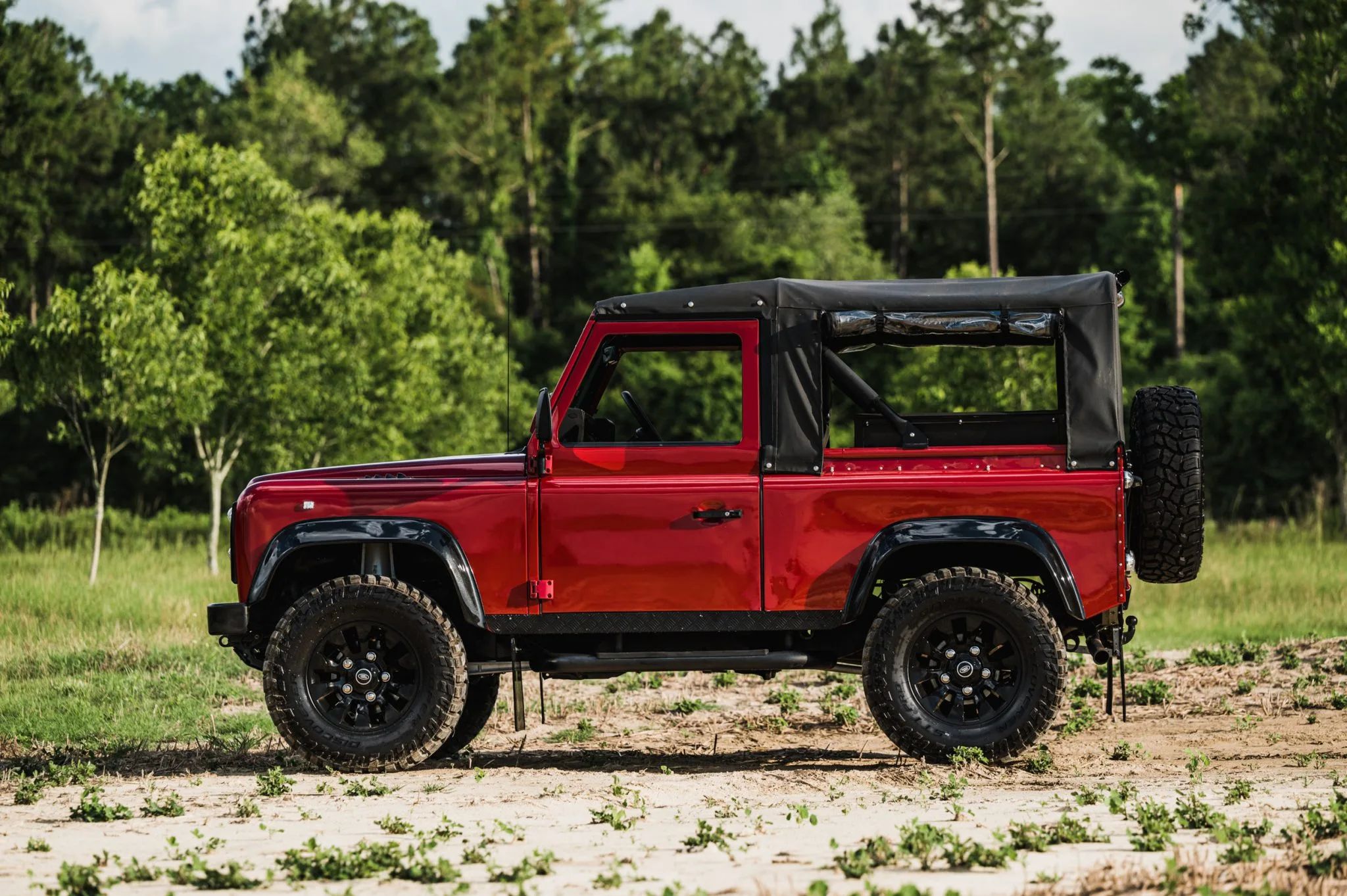 This Red 1996 Land Rover Defender Is Ready For The Toughest Of