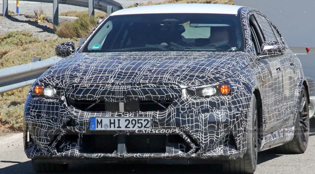  Get A Look At The 2024 BMW M5 Hybrid’s Air-Hungry New Bumper While Towing A Trailer