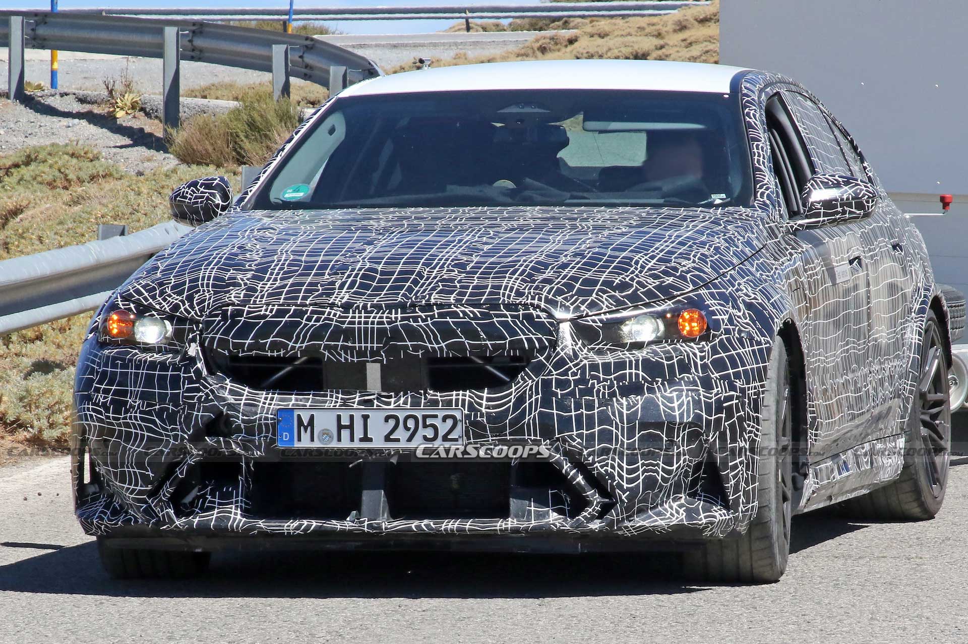 Get A Look At The 2024 BMW M5 Hybrid’s Air-Hungry New Bumper While Towing A Trailer
