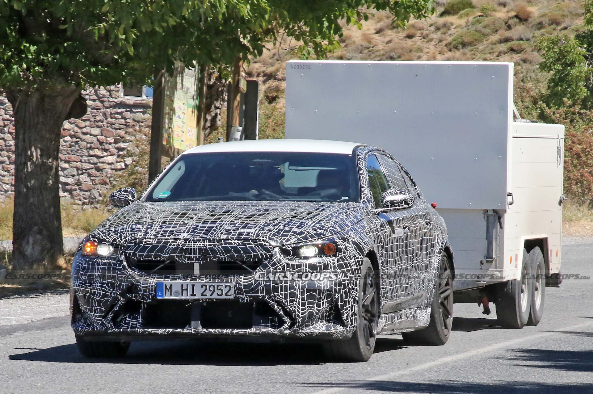 Get A Look At The 2024 BMW M5 Hybrid’s Air-Hungry New Bumper While Towing A Trailer