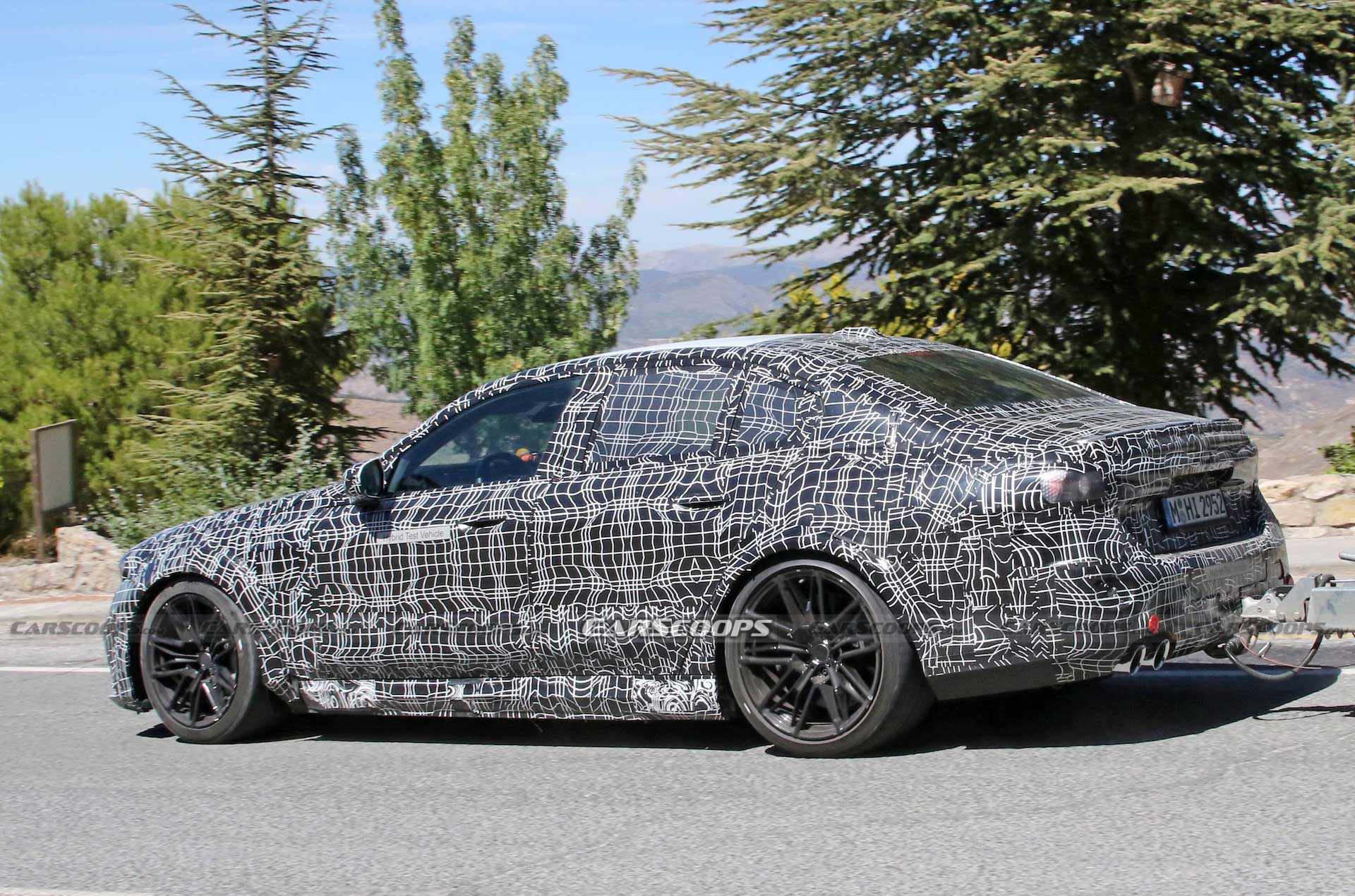 Get A Look At The 2024 BMW M5 Hybrid’s Air-Hungry New Bumper While Towing A Trailer