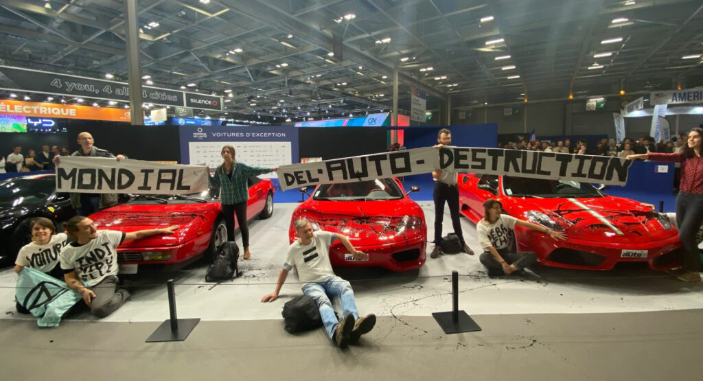  Protesters Glue Themselves To Ferraris At Paris Motor Show, Comes Days After Similar Incident In Germany