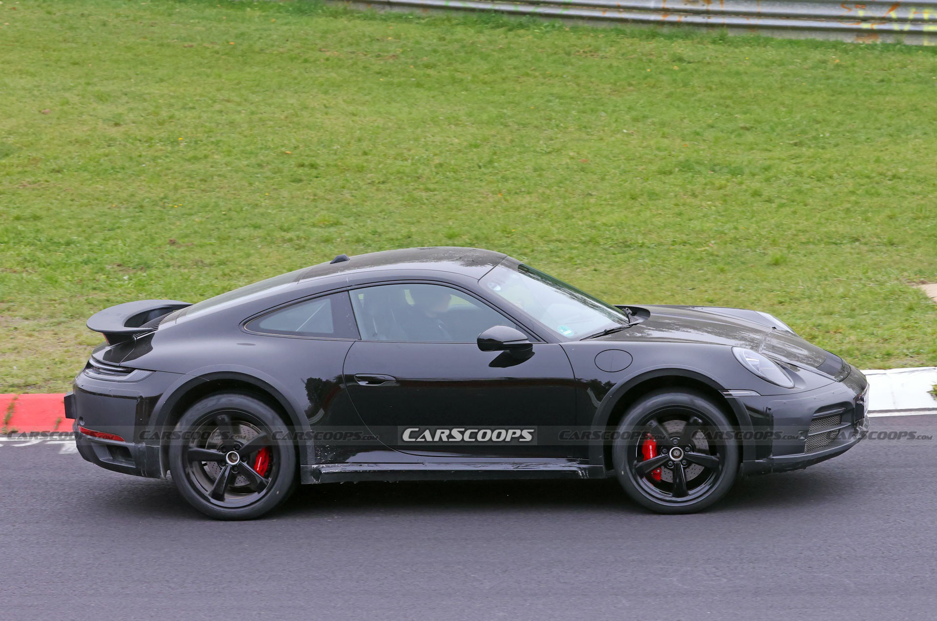 Do These New Spy Shots Reveal The Porsche 911 Dakar’s Air Suspension?