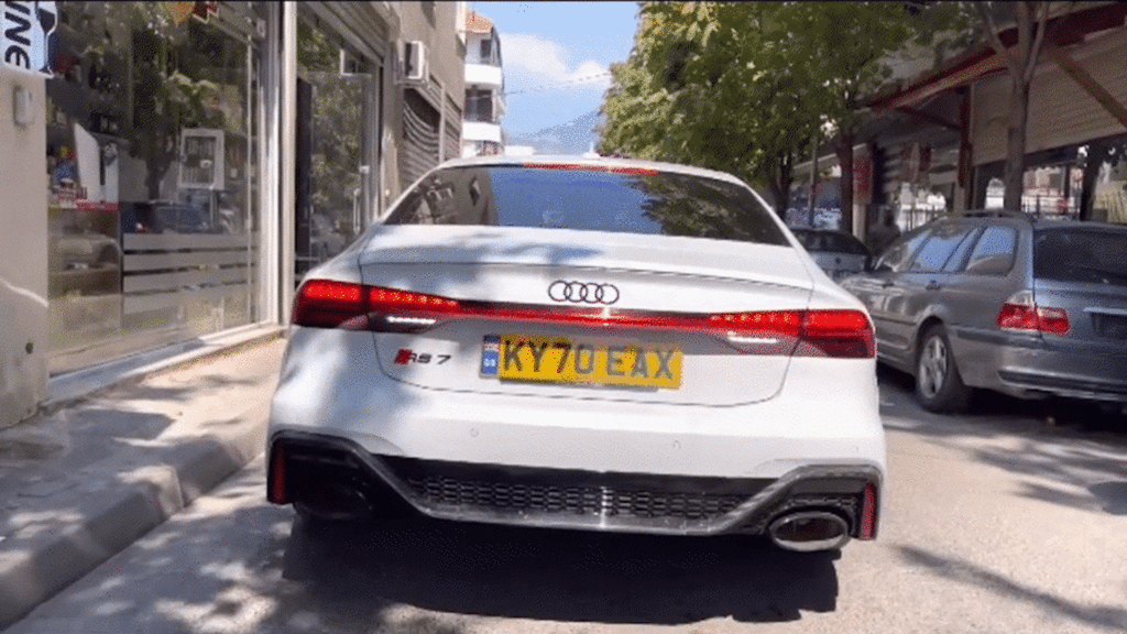 Audi RS7 Driver Does Launch Control In Reverse Knocking Out Cameraman