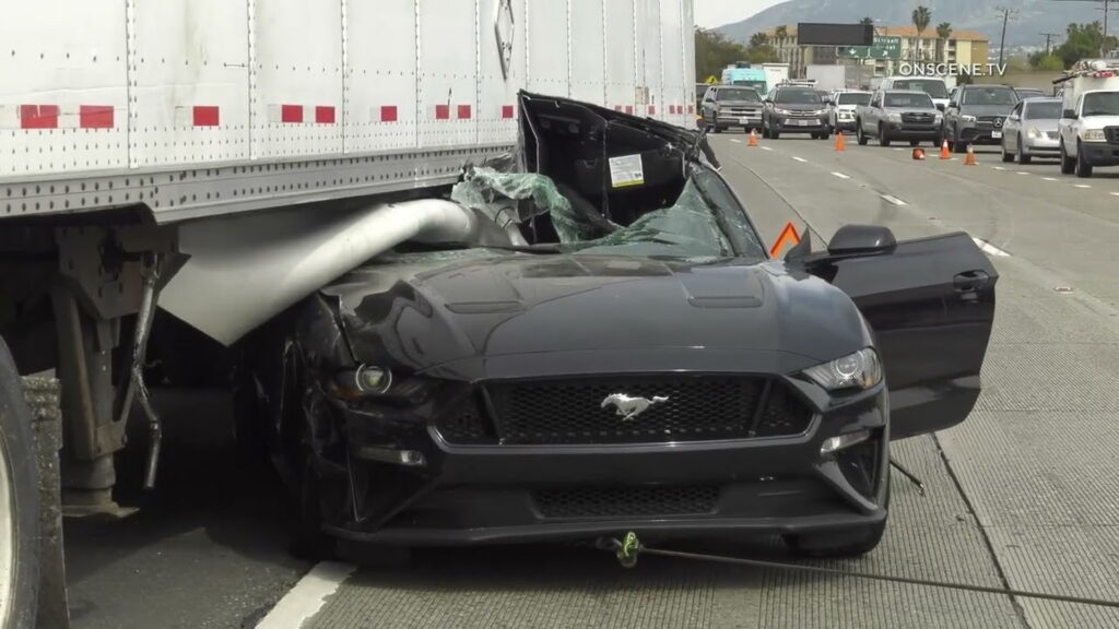  Watch Workers Pull Out A Mustang Wedged Under Big Rig After Horrific Crash