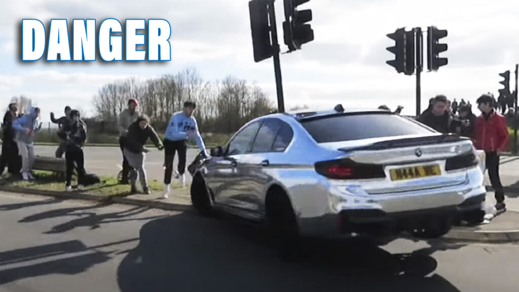 Shiny BMW Plows Into Bystanders And Crashes Into A Traffic Light While Trying To Drift