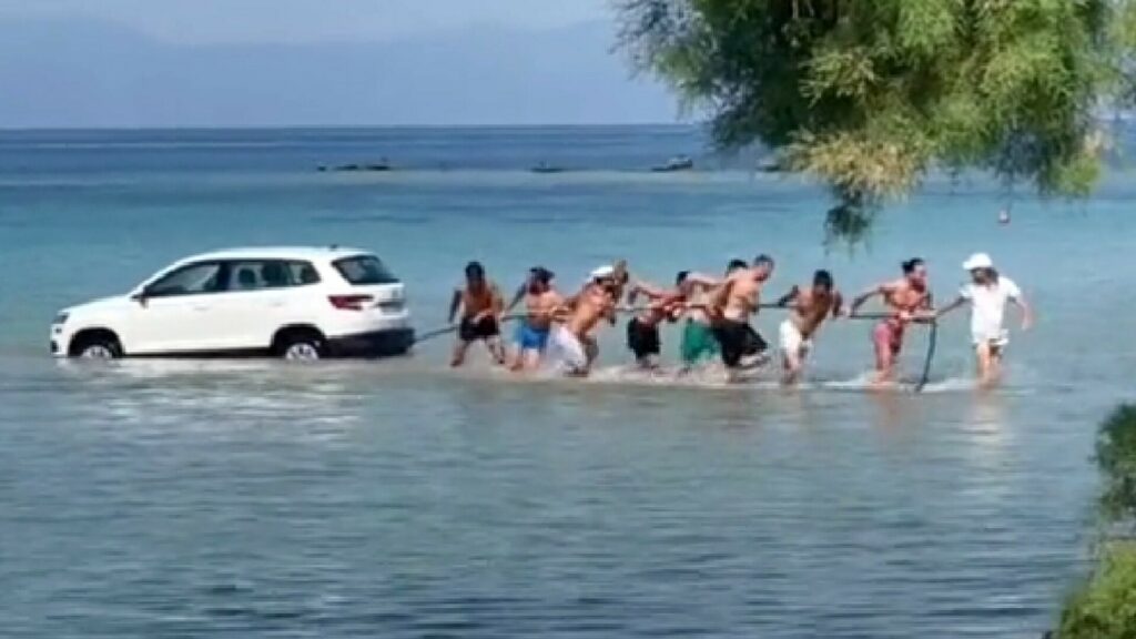  SUV Plunges Into Greek Sea, Bathers Form Human Chain To Save It