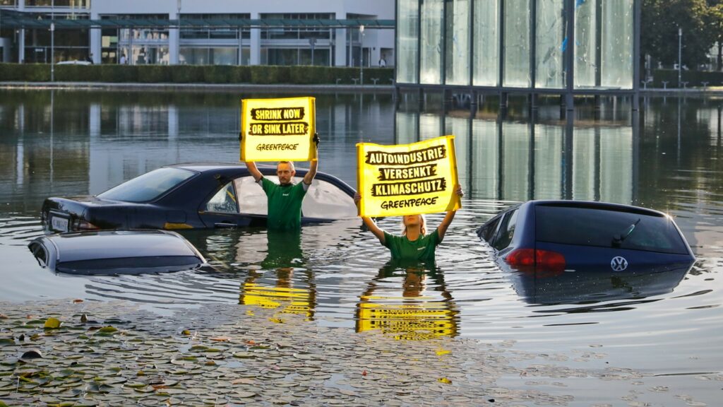  Climate Activists Protest By Sinking Vehicle Parts At The Munich Motor Show