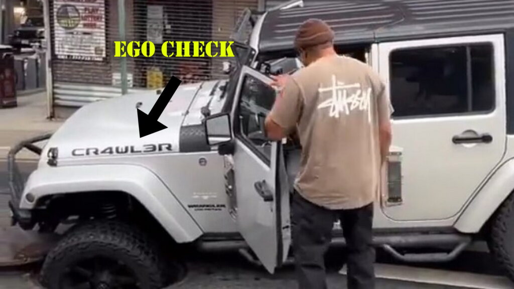  Jeep Wrangler Driver With ‘CR4WL3R’ Graphic Gets Stuck In Manhole