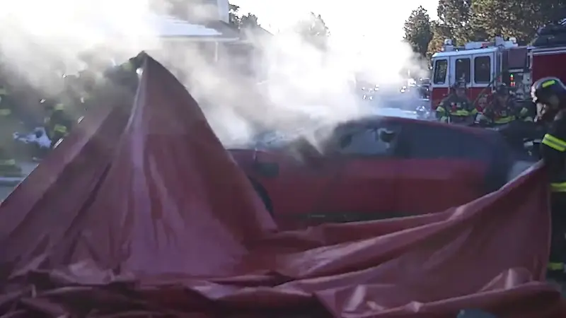  Firefighters Use Cutting-Edge Blanket To Tame Blazing Jaguar EV After Charging Mishap