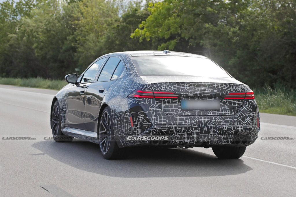     2025 BMW M5 PHEV prototype shows production lighting and charging port