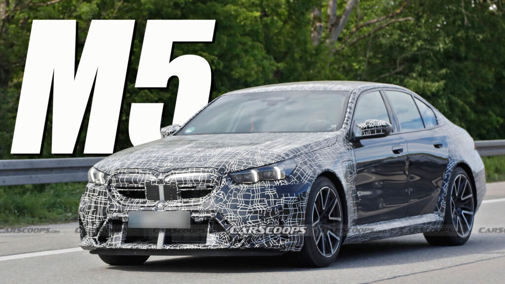     The 2025 BMW M5 PHEV prototype shows production lighting and charging port