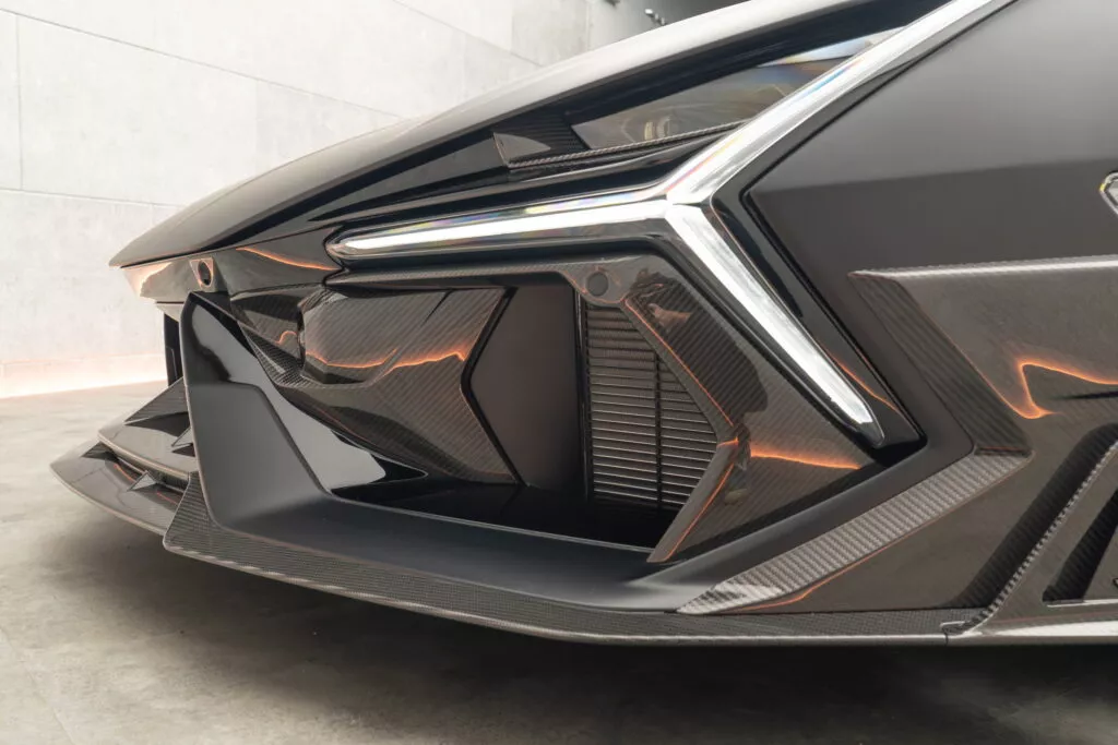 https://www.carscoops.com/wp-content/uploads/webp/2024/12/Lamborghini_Revuelto_by_MANSORY-12-1024x683.webp