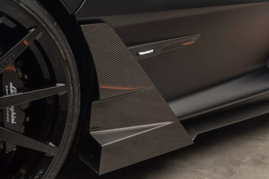 https://www.carscoops.com/wp-content/uploads/webp/2024/12/Lamborghini_Revuelto_by_MANSORY-15-1024x683.webp
