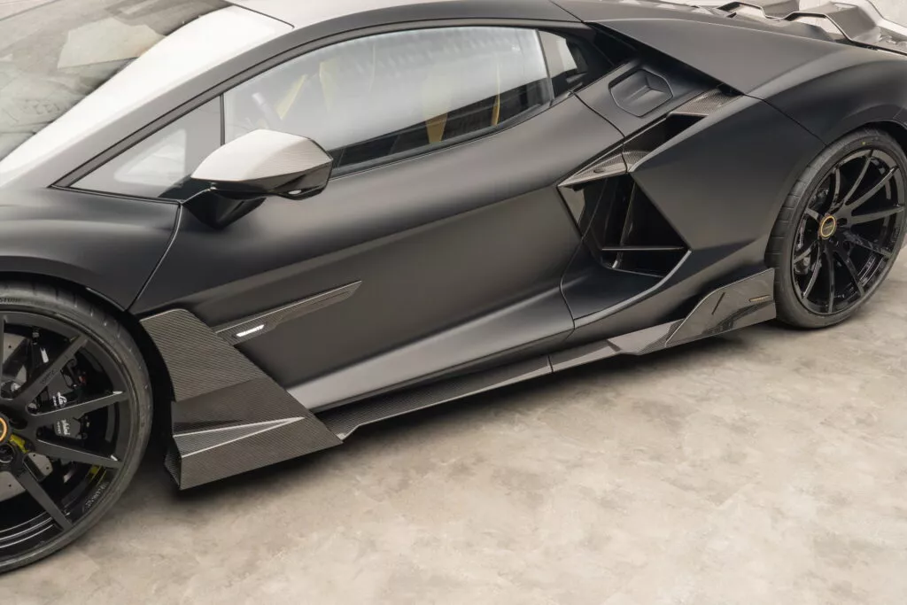 https://www.carscoops.com/wp-content/uploads/webp/2024/12/Lamborghini_Revuelto_by_MANSORY-16-1024x683.webp