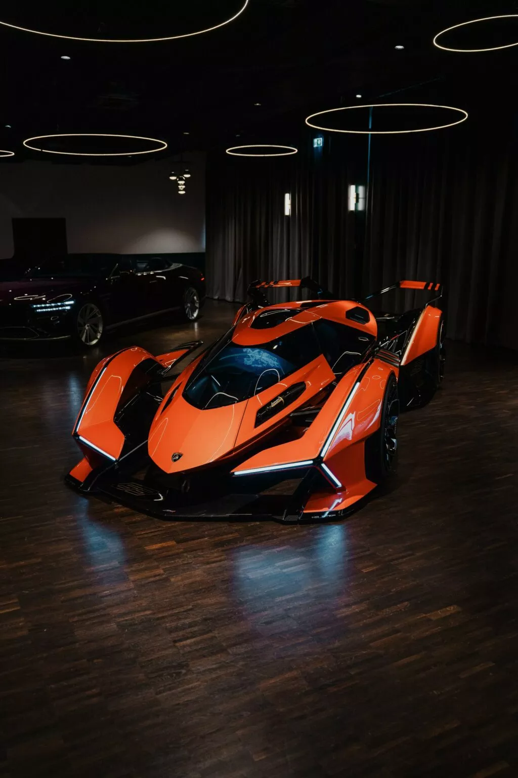 https://www.carscoops.com/wp-content/uploads/webp/2025/05/Lamborghini-Vision-GT-Orange-9-1024x1536.webp