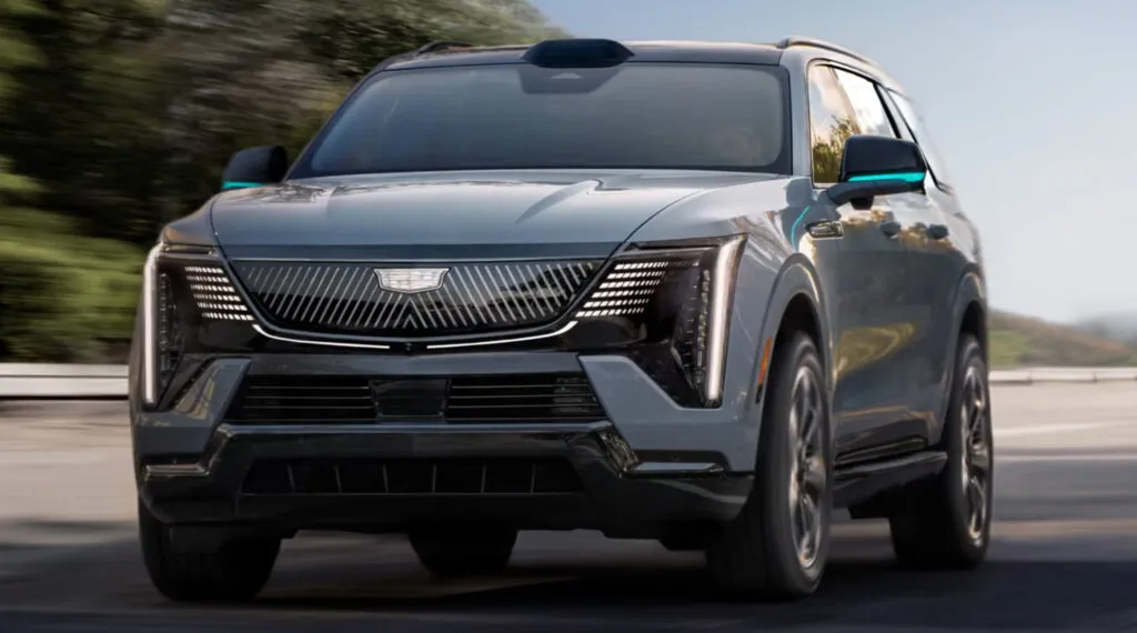 https://www.carscoops.com/wp-content/uploads/webp/2026/05/gm-forward-tech-event-2028-cadillac-escalade-iq-1_result22ccc-1024x570.webp
