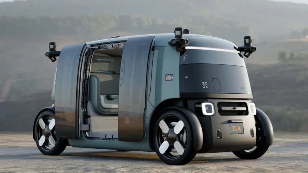 https://www.carscoops.com/wp-content/uploads/webp/2026/06/2026-Zoox-Robotaxi-625-1-1024x576.webp